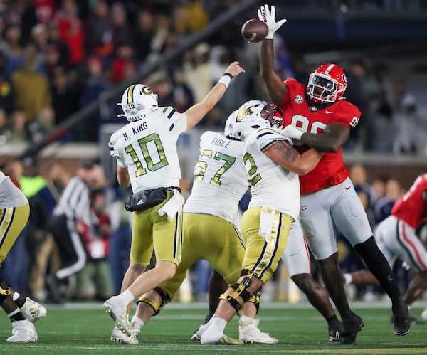 Georgia defensive lineman Zion Logue (96) tips a pass thrown by Georgia Tech quarterback Haynes King (10) during the second half at Bobby Dodd Stadium, Saturday, November 25, 2023, in Atlanta. Georgia won 31-23. (Jason Getz / Jason.Getz@ajc.com)