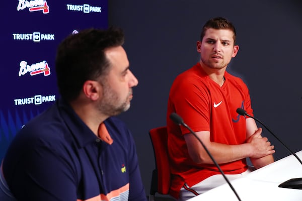 Braves third baseman Austin Riley (right) talks at a press conference while GM Alex Anthopoulos looks on.   “Curtis Compton / Curtis Compton@ajc.com