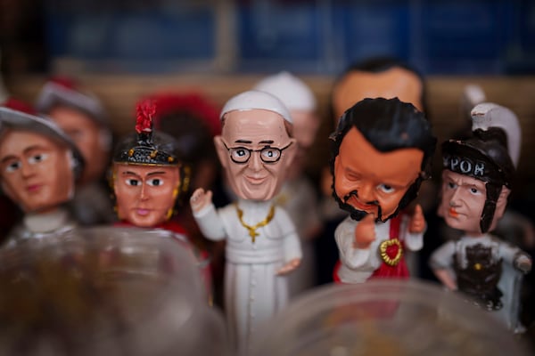 A figure of Pope Francis is displayed for sale at a souvenir shop outside Santa Maria Maggiore Basilica, Tuesday, Feb. 25, 2025 (AP Photo/Bernat Armangue)