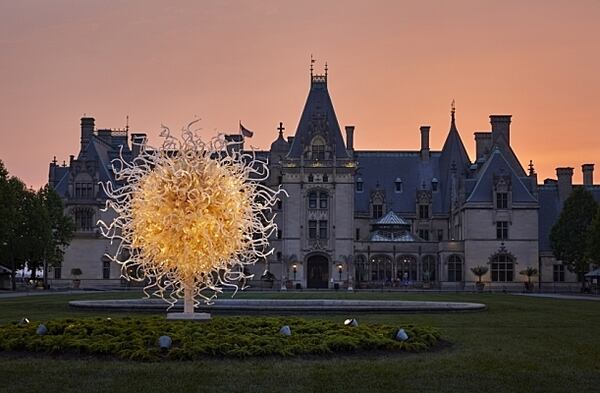 The Biltmore Estate at dusk. Pictured above, sunset views of Chihuly at Biltmore.