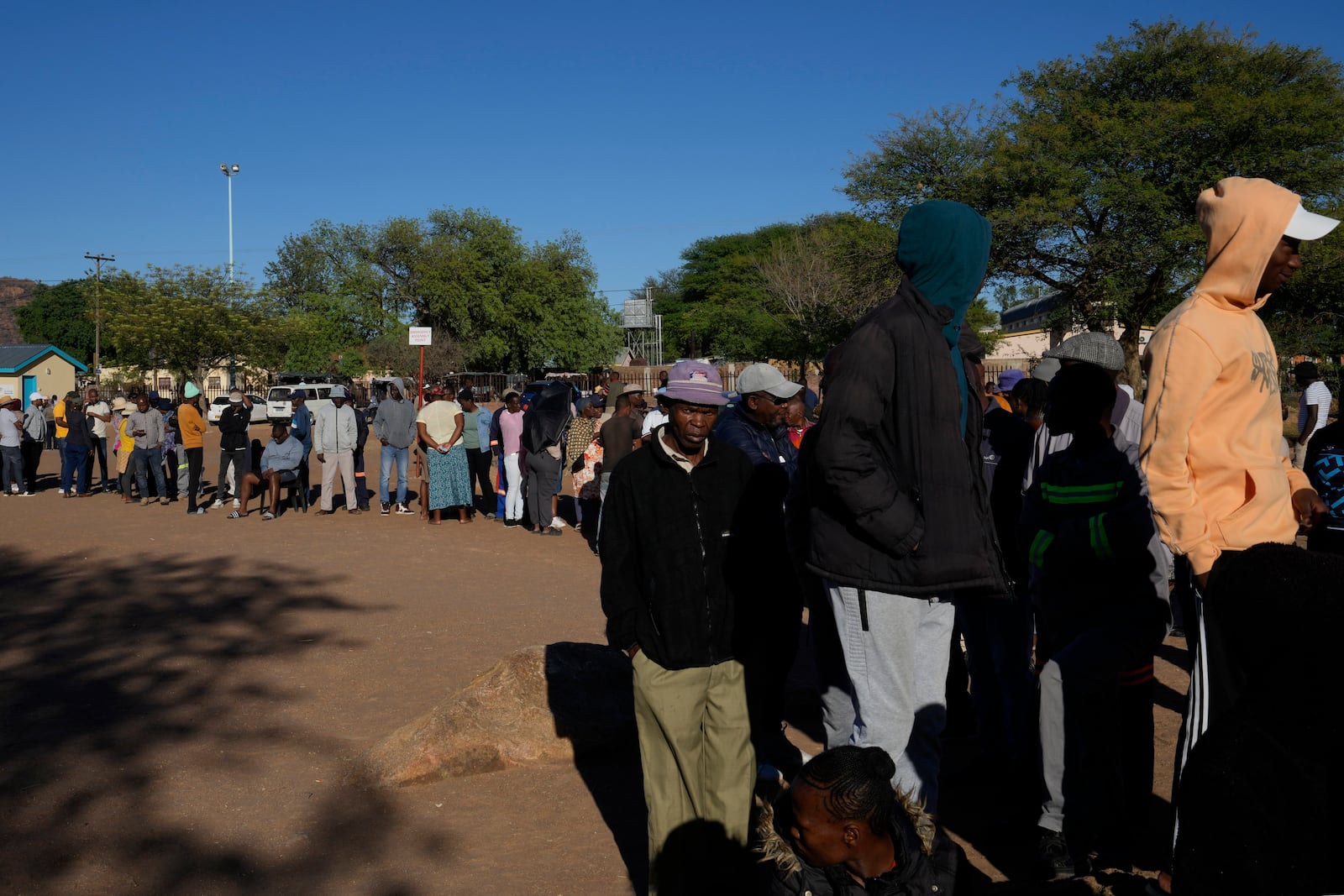 Residents await their turns to cast their votes during an election to decide if it keeps faith with one of the Africa's longest-ruling parties, in Gaborone, Botswana, Wednesday, Oct. 30, 2024. (AP Photo/Themba Hadebe)