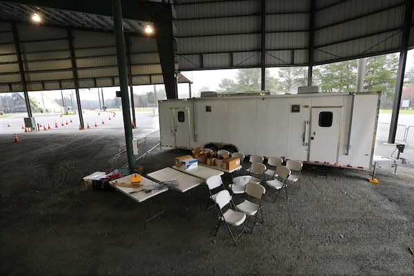 March 17, 2020 Marietta: Health department officials are setting up for the drive-thru testing of coronavirus in Jim Miller Park with a medical trailer seen at the Cobb County Outdoor Arena inside the park on Tuesday, March 17, 2020, in Marietta. Curtis Compton ccompton@ajc.com