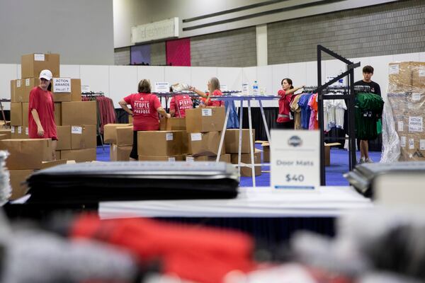 Workers prepare a hall in the Georgia World Congress Center on Tuesday, June 28, 2022, for a Primerica convention that will begin on Wednesday in both the center and Mercedes-Benz Stadium in Atlanta. Primerica, a Duluth-based financial services company, expects 35,000 attendees from across North America for its biennial convention. (Chris Day/Christopher.Day@ajc.com)