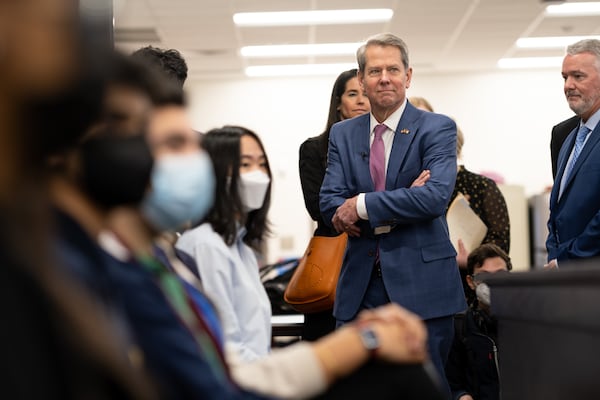 Gov. Brian Kemp observes a mock courtroom during a tour or the Alliance Academy for Innovation in Cumming on Monday, Jan. 31, 2022. Ben Gray for the Atlanta Journal-Constitution