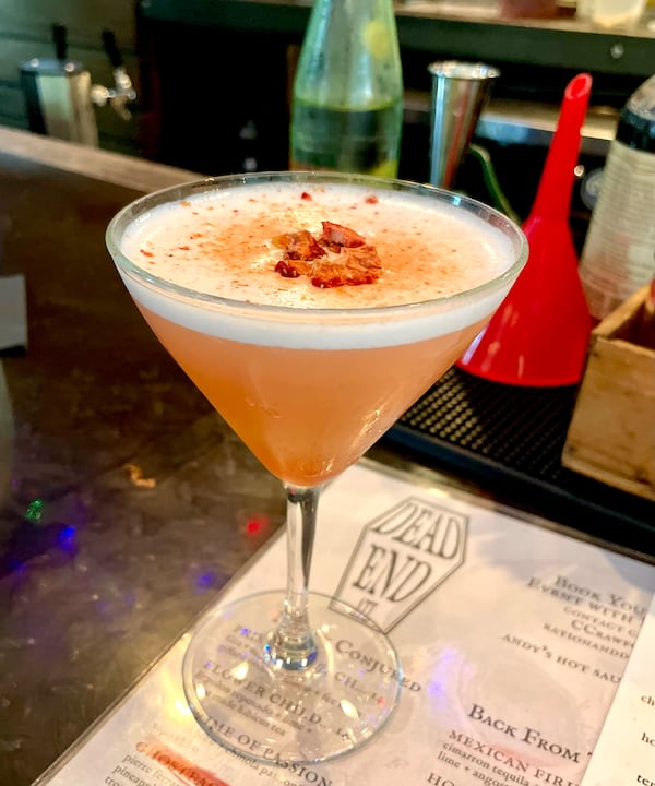 The princess peach is aromatic, with a sweetness from peach and strawberry and herbal foam made with bitters. (Angela Hansberger for The Atlanta Journal-Constitution)