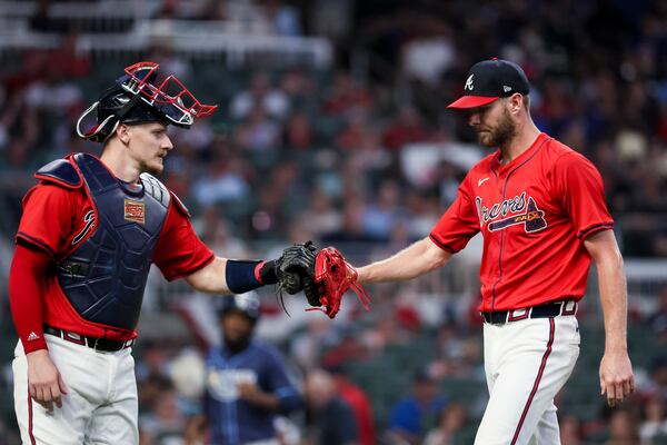 Atlanta Braves starting pitcher Chris Sale, right, greets Atlanta Braves catcher Sean Murphy (12) after the final out during the sixth inning against the Tampa Bay Rays at Truist Park, Friday, June 14, 2024, in Atlanta. The Braves won 7-3. (Jason Getz / AJC)
