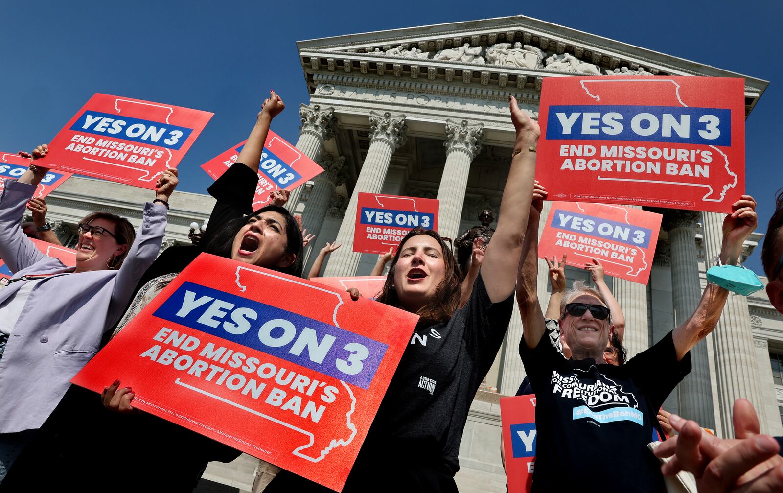 Amendment 3 supporters Luz Maria Henriquez, second from left, executive director of the ACLU Missouri, celebrates with Mallory Schwarz, center, of Abortion Action Missouri, after the Missouri Supreme Court in Jefferson City, Mo., ruled that the amendment to protect abortion rights would stay on the November ballot in on Tuesday, Sept. 10, 2024. (Robert Cohen/St. Louis Post-Dispatch via AP)