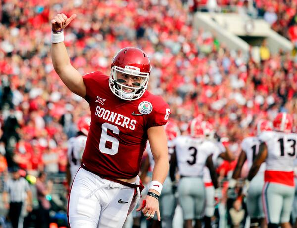 FILE - In this Jan. 1, 2018, file photo, Oklahoma quarterback Baker Mayfield celebrates after running back Rodney Anderson scored a touchdown against Georgia during the first half of the Rose Bowl NCAA college football game in Pasadena, Calif. Mayfield is expected to be a first round pick in the NFL Draft.(AP Photo/Jae C. Hong, File)