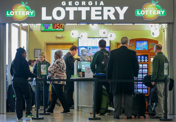 SECONDARY PHOTO - January 12, 2016 Hartsfield-Jackson International Airport : Lines formed outside at the Georgia Lottery Airport South Kiosk at Hartsfield-Jackson International Airport on Tuesday,  Jan. 12, 2016 as the record-breaking Powerball jackpot continued to climb, hitting $1.5 billion ahead of Wednesdays' drawing, according to the Georgia Lottery. Players who would take the cash option would win $930 million, before taxes. Winning isn't everything, though, and players should expect a barrage of con artists, lawsuit filers and taxes when they win. Remember, though, even if Wednesday's drawing fails to declare a winner, the children are the real winners. Since Powerball began rolling over on Nov. 7, the jackpot has generated an estimated $26.9 million for Georgia Lottery-funded Pre-K and HOPE Scholarships. Players have had until 10 p.m. Wednesday to buy $2 tickets, according to lottery officials. The drawing was held at 11 p.m. EST. and the result not available at the time of this report. JOHN SPINK /JSPINK@AJC.COM