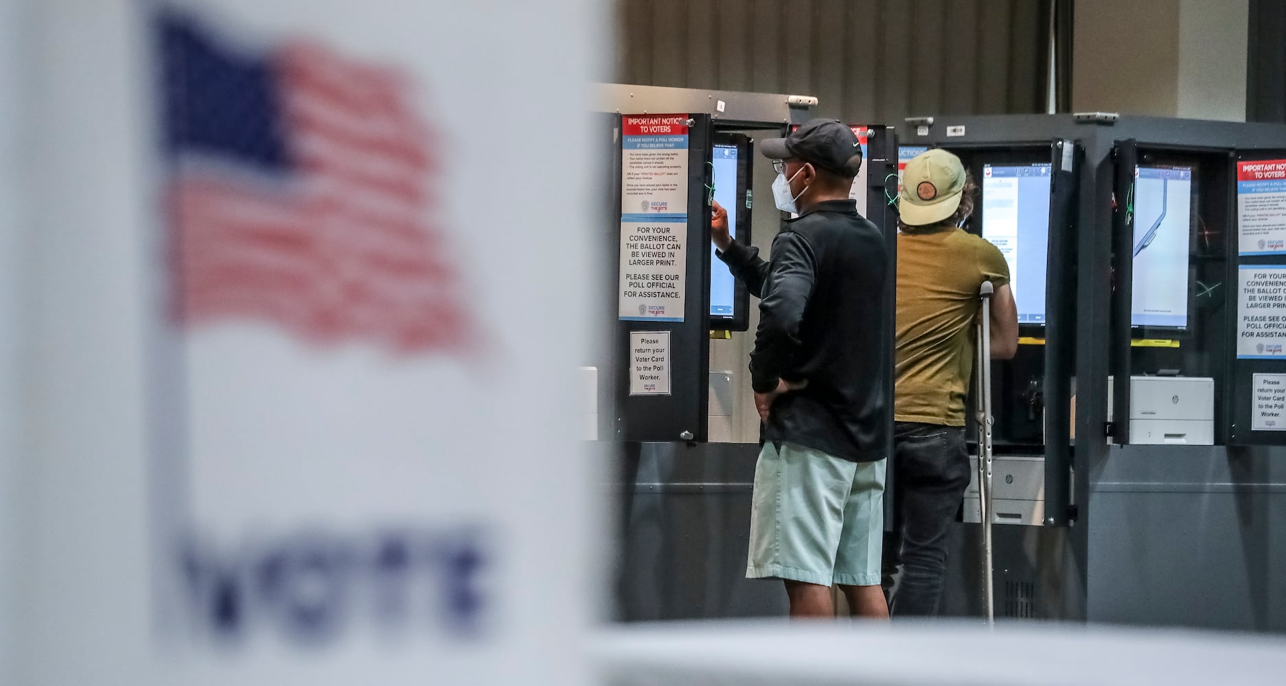 November 8, 2022 Fulton County: Left to right, Voters Michael Parks and Brett Ringel cast ballots on Tuesday, Nov. 8, 2022 at the Antioch Baptist Church located at 540 Cameron Madison Alexander Boulevard NW in Atlanta. (John Spink / John.Spink@ajc.com) 

