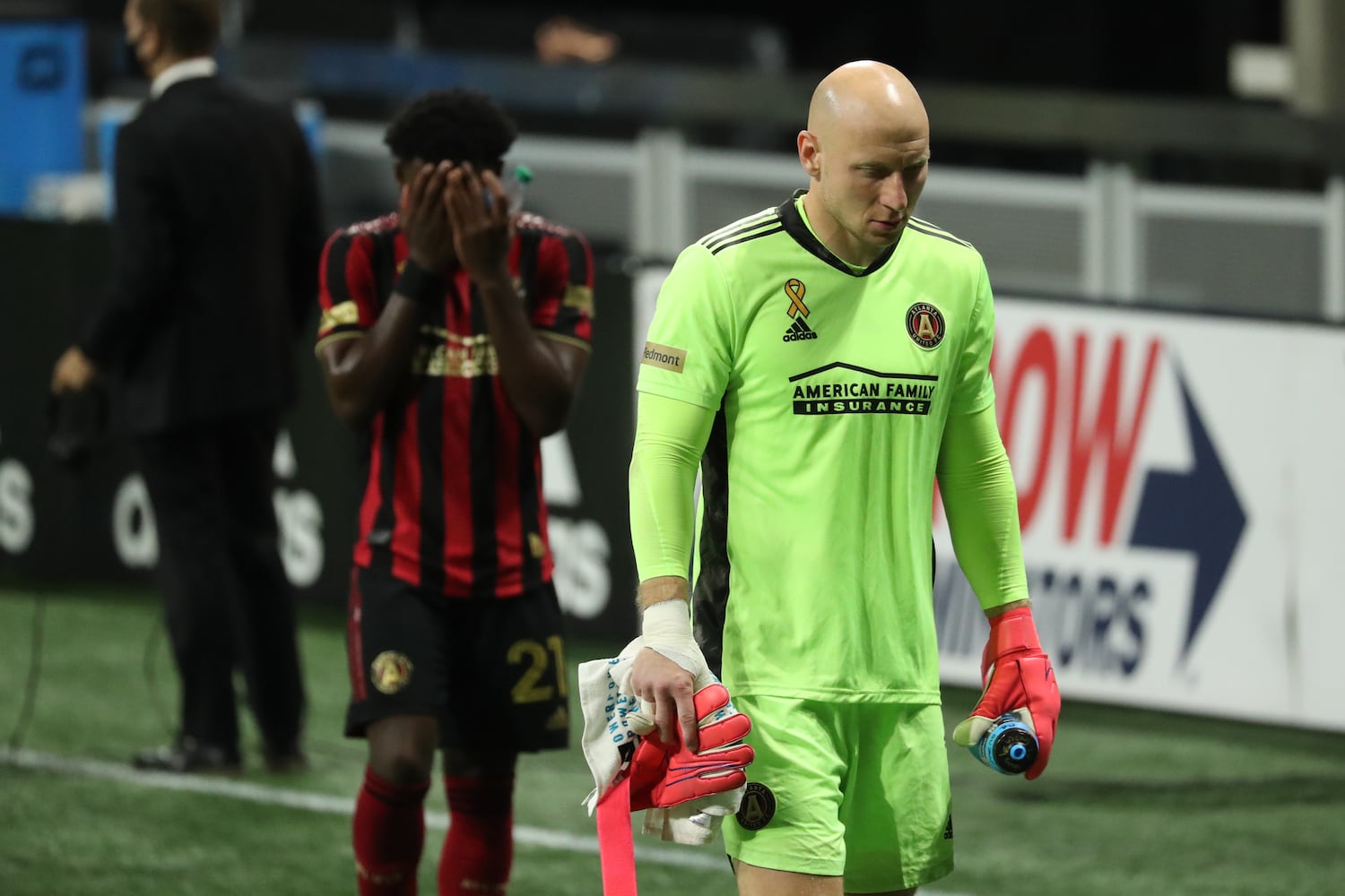 Atlanta United defender George Bello, left, and goalkeeper Brad Guzan react after their 2-1 loss to Miami at Mercedes-Benz Stadium Saturday, September 19, 2020 in Atlanta. JASON GETZ FOR THE ATLANTA JOURNAL-CONSTITUTION