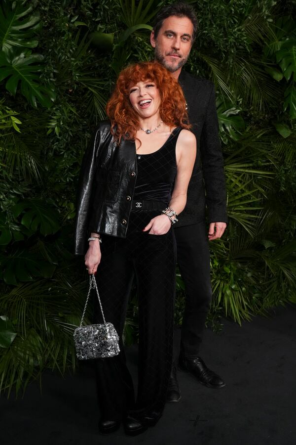 Natasha Lyonne, left, and Bryn Mooser arrive at Chanel's 16th Annual Pre-Oscar Awards Dinner on Saturday, March 1, 2025, at The Beverly Hills Hotel in Beverly Hills, Calif. (Photo by Jordan Strauss/Invision/AP)