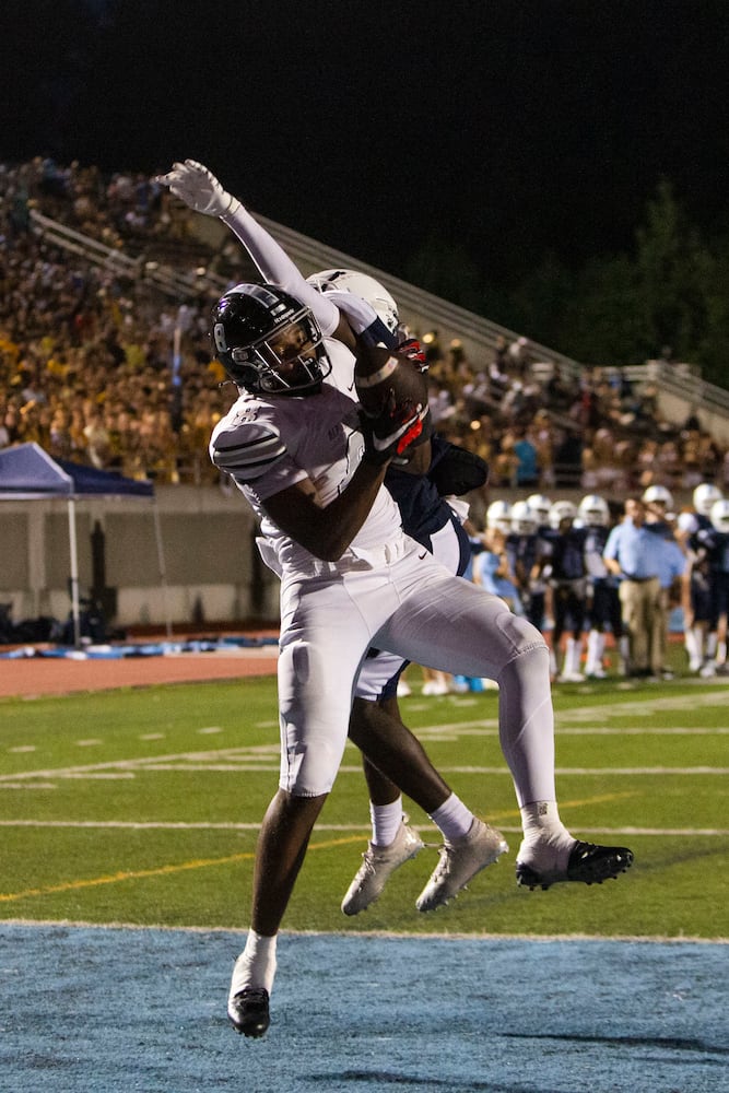 Jack Marlow, running back for Cambridge High School scores a touchdown during the Cambridge v. Alpharetta high school football game on Friday, September 2, 2022, at Cambridge High School in Milton, Georgia. Alpharetta tied Cambridge 28-28 in the third quarter. CHRISTINA MATACOTTA FOR THE ATLANTA JOURNAL-CONSTITUTION.