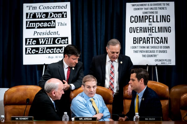 Rep. Jim Jordan (R-Ohio), center bottom, speaks with GOP colleagues on a break during a hearing about the impeachment of Donald Trump, in Capitol Hill, Washington, on Dec. 4, 2019. J(Erin Schaff/The New York Times)
                      