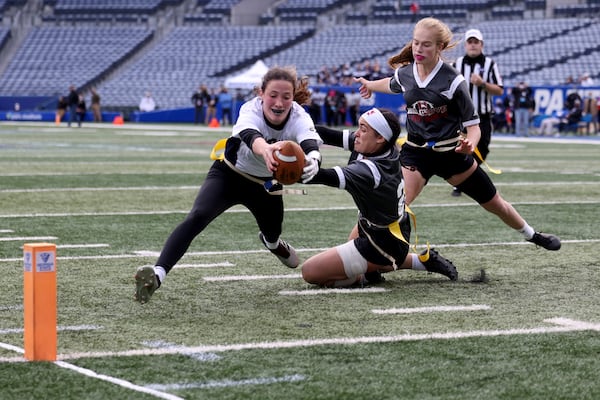 West Forsyth quarterback Haylee Dornan, center, scores the game-winning extra point. JASON GETZ FOR THE ATLANTA JOURNAL-CONSTITUTION



