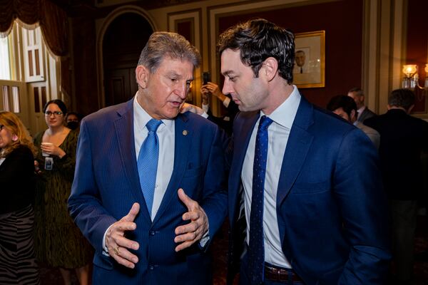 Democrtic U.S. Sens. Joe Manchin of West Virginia, left, and Jon Ossoff speak in December at a U.S. Capitol event marking the creation of the Senator Johnny Isakson Department of Veterans Affairs Atlanta Regional Office. (Nathan Posner for the Atlanta Journal-Constitution)