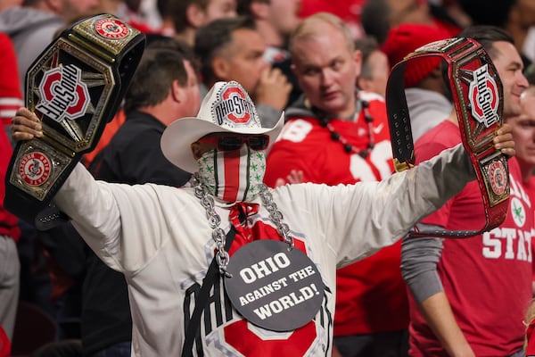 A Ohio State fan celebrates during the first half of Ohio State’s game against Notre Dame in the 2025 National Championship at Mercedes-Benz Stadium, Monday, Jan. 20, 2025, in Atlanta. (Jason Getz / AJC)