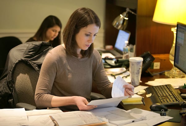 Kristen Bates (foreground) & Elizabeth King (both cq) process paperwork at the Dorsey Alston offices in Buckhead. The company has been voted the No 1 Top medium workplace in Atlanta. (Photo by Phil Skinner)