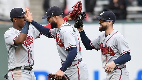 Braves teammates Ronald Acuna (from left), Nick Markakis  and Ender Inciarte celebrate defeating the San Francisco Giants, 2-1, Sept. 12, 2018, at AT&T Park in San Francisco.