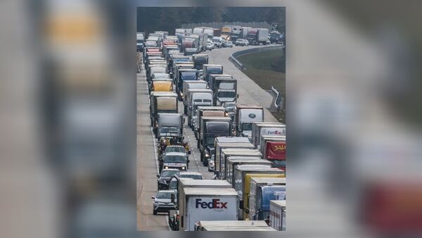 Heavy delays remained after long after I-75 North reopened Tuesday. JOHN SPINK / JSPINK@AJC.COM