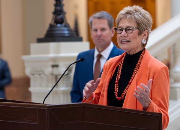 In this file photo, Dr. Kathleen Toomey gives an update about COVID at State Capitol as Gov. Brian Kemp listens. Ben Gray for the Atlanta Journal-Constitution