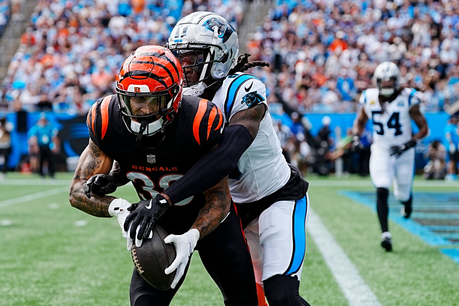 Carolina Panthers cornerback Jaycee Horn breaks up a pass intended for Cincinnati Bengals running back Chase Brown during the first half of an NFL football game, Sunday, Sept. 29, 2024, in Charlotte, N.C. (AP Photo/Rusty Jones)