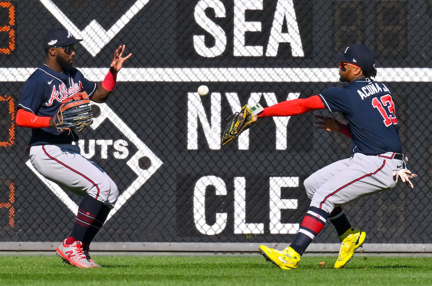 Braves right fielder Ronald Acuna fails to field a ball hit by Philadelphia's Brandon Marsh as center fielder Michael Harris backs him up during the fourth inning Saturday in Game 4 of the NLDS against the host Phillies. (Hyosub Shin / Hyosub.Shin@ajc.com)