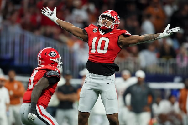 Georgia linebacker Damon Wilson II (10) reacts after sacked Texas quarterback Quinn Ewers (not pictured) during the third quarter in the 2024 SEC Championship game at Mercedes-Benz Stadium, Saturday, December 7, 2024, in Atlanta. Georgia won 22-19 in overtime. Jason Getz / AJC)
