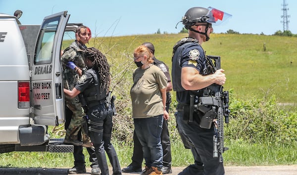 Police make arrests Tuesday, May 17, 2022, at encampment of opposition to the massive training center planned for Atlanta’s police officers and firefighters. (John Spink/ John.Spink@ajc.com)