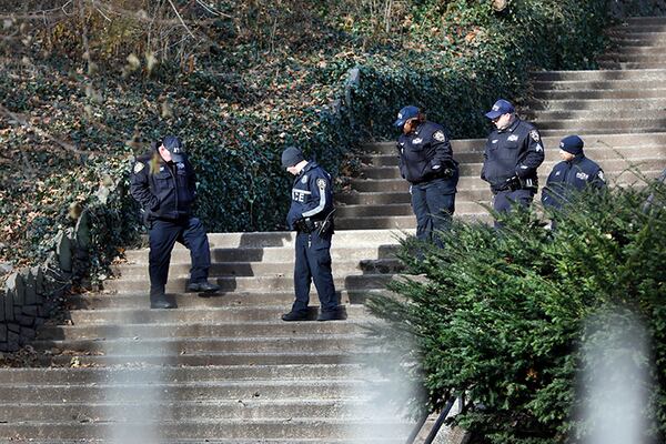 Law enforcement officers search Morningside Park on Thursday after an 18-year-old Barnard College freshman was fatally stabbed there during an armed robbery.