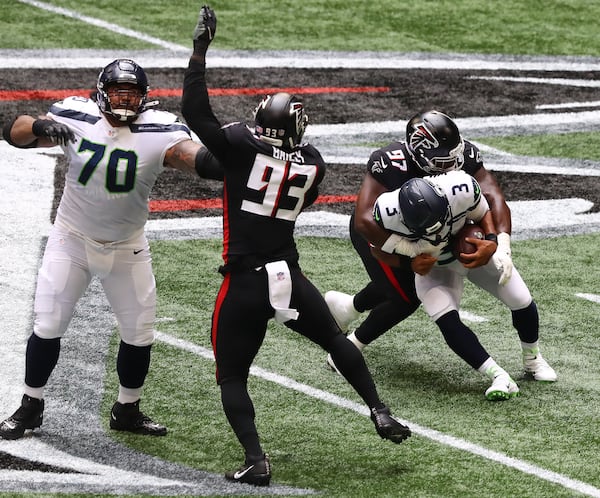 Falcons defensive tackle Grady Jarrett sacks Seattle Seahawks quarterback Russel Wilson during the first half Sunday, Sept. 13, 2020, in Atlanta. (Curtis Compton / Curtis.Compton@ajc.com)