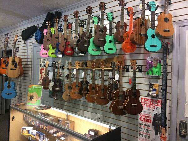 A wall of ukuleles line a portion of Town Center Music in Suwanee. The shop sells all types of instruments and musical accessories, does repairs, provides lessons — and sometimes even provides tuneups for professional musicians before a performance in nearby Town Center Park. JILL VEJNOSKA / JVEJNOSKA@AJC.COM