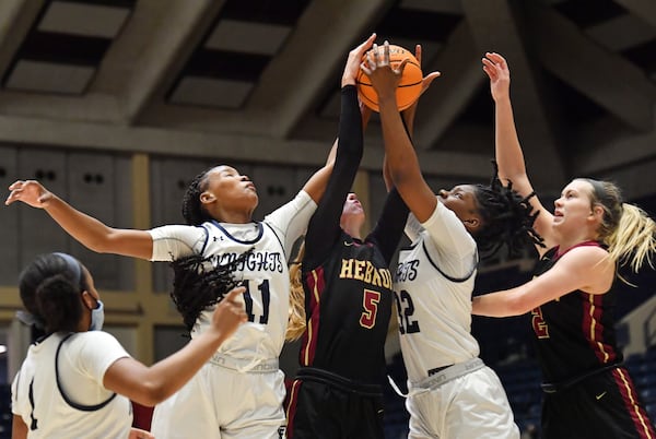 Hebron Christian's Carly Heidger (5) fights for a rebound against St. Francis players during the Class A Private girls basketball championship game Wednesday, March 10, 2021, at the Macon Centreplex in Macon. (Hyosub Shin / Hyosub.Shin@ajc.com)