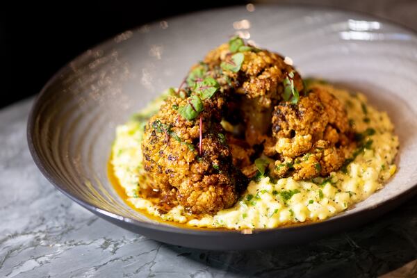 Blue Ridge Farm Cauliflower Steak with saffron risotto and micro amaranth. Photo credit- Mia Yakel.