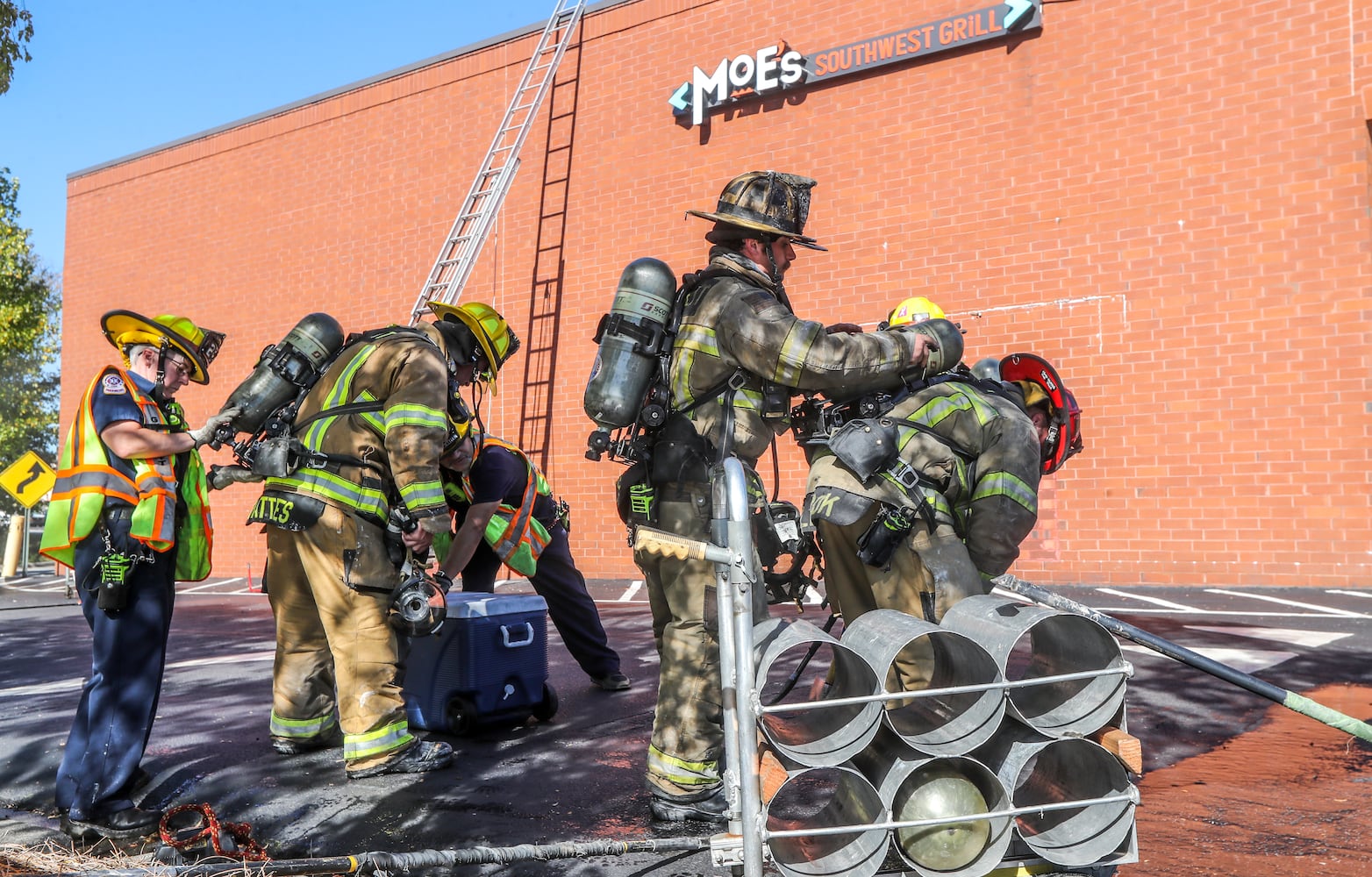 Gwinnett County fire crews were called to a fire at a Moe’s Southwest Grill on Stone Mountain Highway in the Lilburn area, about an hour after they responded to another fire at an apartment building on Spruce Circle, just outside Snellville. (John Spink / John.Spink@ajc.com) 
