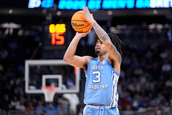 North Carolina guard Elliot Cadeau prepares to shoot a 3-point basket against Mississippi during the second half in the first round of the NCAA college basketball tournament Friday, March 21, 2025, in Milwaukee, Wis. (AP Photo/Kayla Wolf)