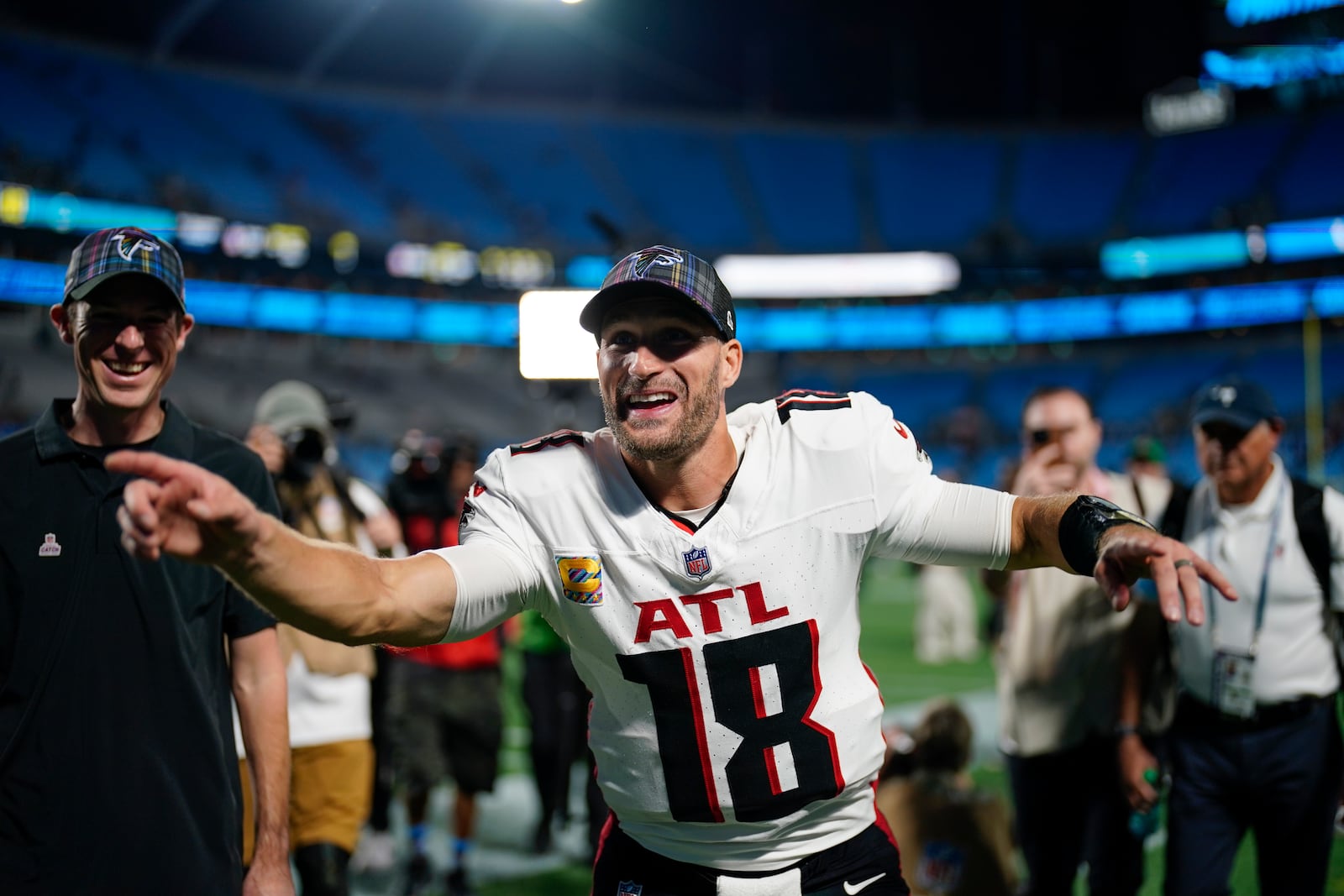 Atlanta Falcons quarterback Kirk Cousins (18) walks off the field after an NFL football game against the Carolina Panthers in Charlotte, N.C., Sunday, Oct. 13, 2024. (AP Photo/Jacob Kupferman)