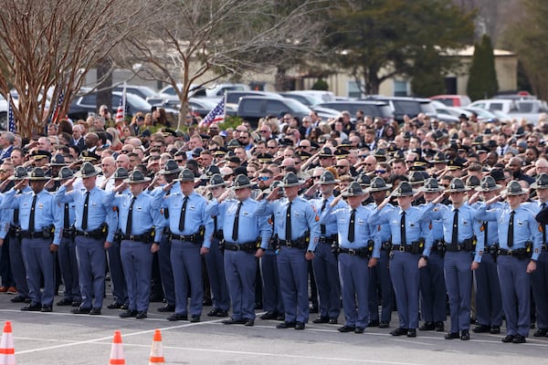 Law enforcement officers salute outside of Griffin First Assembly during the memorial service for Spalding County Sheriff’s Office Sgt. Marc “Mac” McIntyre, Friday, January 5, 2024, in Griffin, Ga. Sgt. McIntyre was fatally shot while responding to a request for a welfare check in Griffin on Friday, Dec. 29, 2023. (Jason Getz / Jason.Getz@ajc.com)