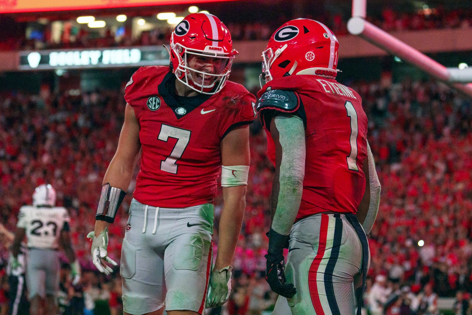 Georgia running back Trevor Etienne (1) celebrates with Georgia tight end Lawson Luckie (7) after scoring a touchdown during an NCAA college football game against Mississippi State, Saturday, Oct. 12, 2024, in Athens, Ga. (AP Photo/Jason Allen)