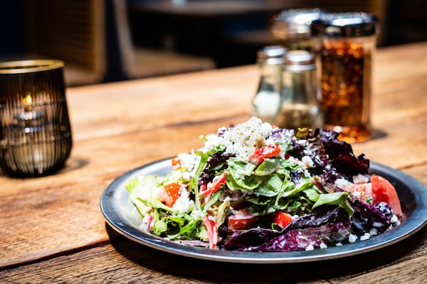 Ammazza’s Insalata di Basil is made with field greens, marinated artichokes, Kalamata olives, red bell peppers, tomatoes, goat cheese and a creamy basil dressing. CONTRIBUTED BY HENRI HOLLIS