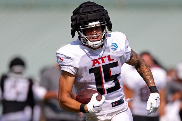 Falcons quarterback / tight end Feleipe Franks reacts after making a catch during training camp Tuesday in Flowery Branch. (Jason Getz / Jason.Getz@ajc.com)