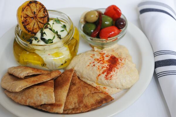 Marinated feta with charred lemon, hummus, grilled pita, olives and extra virgin olive oil at Tom Tom. (Beckystein.com)