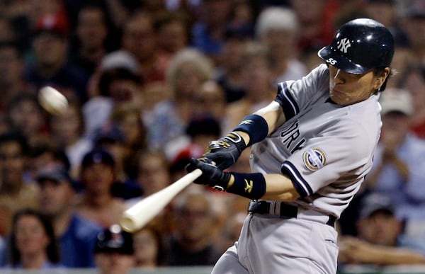 FILE - New York Yankees' Hideki Matsui belts a solo home run, his second of the game, off Boston Red Sox starter Josh Beckett during the eighth inning of their baseball game at Fenway Park in Boston, Sunday Aug. 23, 2009. (AP Photo/Charles Krupa, File)