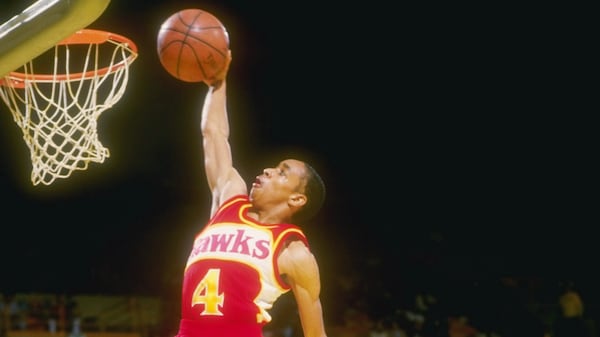 Short Hawks king Spud Webb says hello to the rim during a 1987 game against the Lakers.