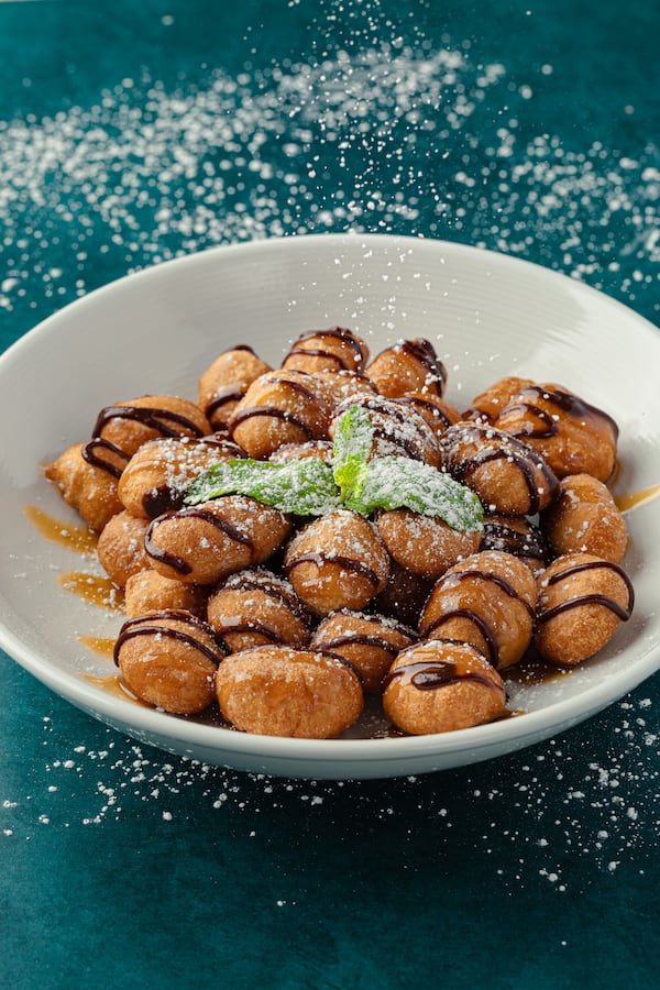 Sunnyside Pizzeria offers deep-fried pizza dough with drizzles of nutella and caramel for dessert. Courtesy of Ryan Aaron