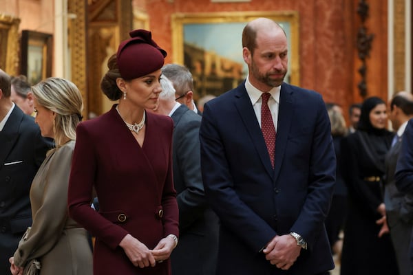 Britain's Catherine, Princess of Wales stands next to Prince William, Prince of Wales, as Qatari Emir Sheikh Tamim bin Hamad al-Thani and his wife Sheikha Jawaher bint Hamad bin Suhaim Al-Thani visit Buckingham palace in London, Britain, Tuesday, Dec. 3, 2024. (Mina Kim/Pool via AP)