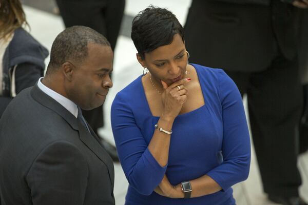 On his final workday at Atlanta City Hall on Dec. 29, 2017, then-Mayor Kasim Reed talks with his successor, Keisha Lance-Bottoms. She was sworn in as mayor on Jan. 2, 2018. ALYSSA POINTER/ALYSSA.POINTER@AJC.COM