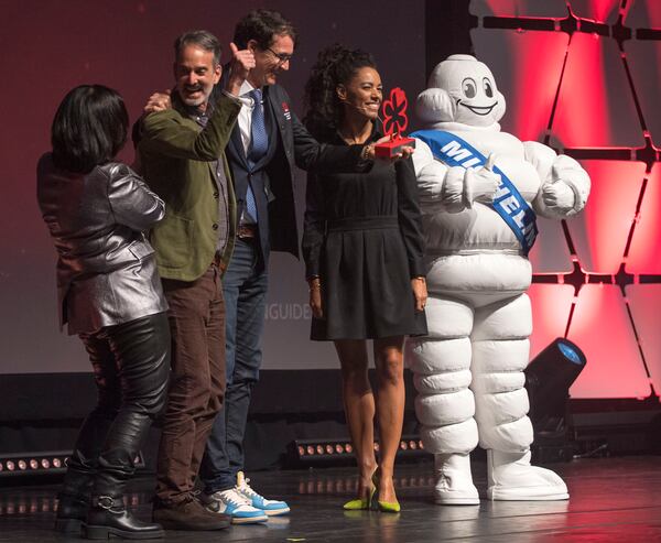 Event hosts Mara Davis (far left) and Elisabeth Boucher-Anselin (far right) are seen with awardees Steven Satterfield (middle left) and Neal McCarthy (middle right) of Miller Union during the Atlanta Michelin Guide gala ceremony Tuesday, Oct. 24, 2023 at the Rialto Center for the Arts in Atlanta. (Daniel Varnado/ For the AJC)