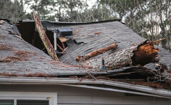 January 28, 2021 DeKalb County: A 1-year-old girl was rescued from a DeKalb County home Thursday morning, Jan. 28, 2021 after a tree fell on her bedroom, breaking through the ceiling just feet above her crib. (John Spink / John.Spink@ajc.com)