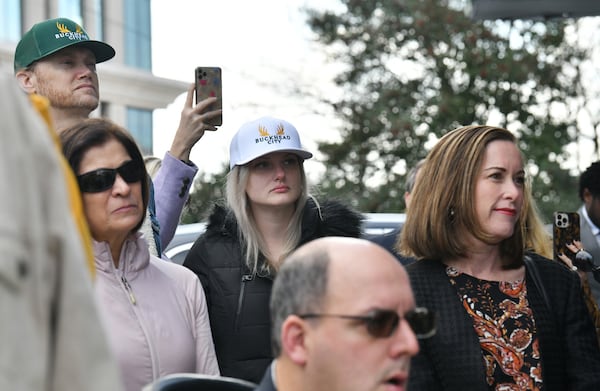 Buckhead cityhood supporters watch as Bill White, chairman and CEO of the Buckhead City Committee, speaks to members of the press during a news conference on Tuesday, February 18, 2022. (Hyosub Shin / Hyosub.Shin@ajc.com)